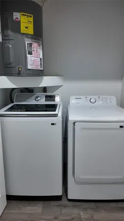 a utility room with dryer and washer