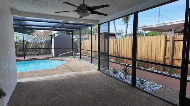 a view of a backyard with a swimming pool