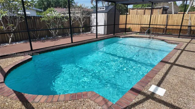 a view of swimming pool with a patio