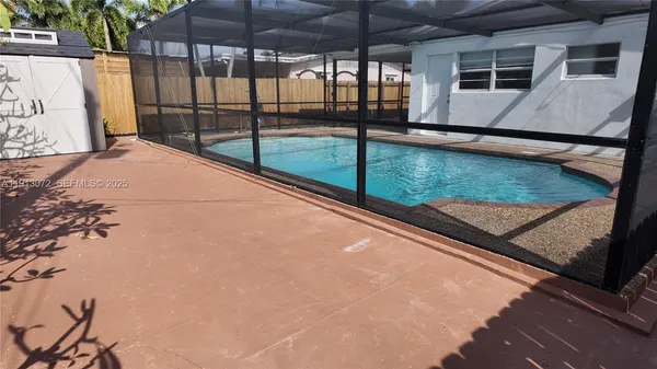 a view of swimming pool with a patio