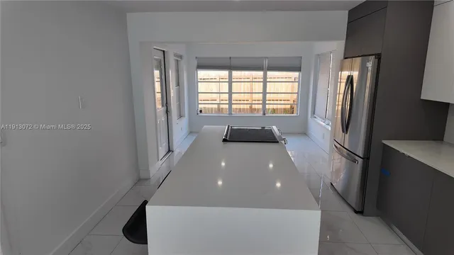 a bathroom with a bathtub and a window