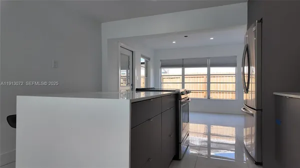 a kitchen with a large window