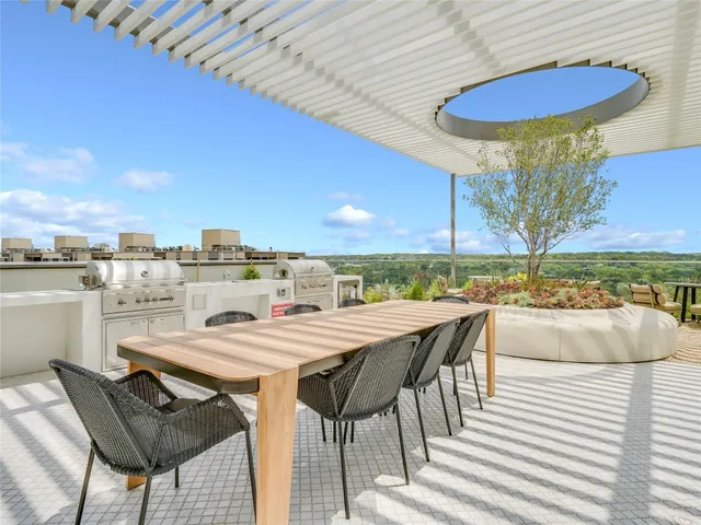 a view of a dinning table and chairs in the terrace