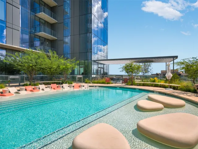 a view of swimming pool having outdoor seating