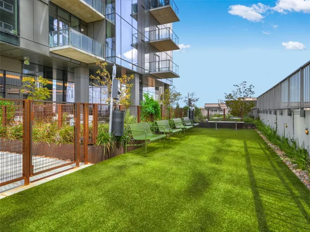 a view of a building with a yard