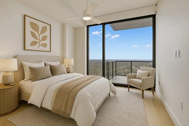 a bedroom with a bed and a large mirror