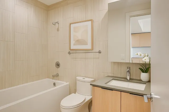 a bathroom with a sink a toilet and bathtub