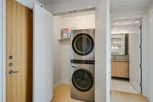 a view of a hallway with washer and dryer