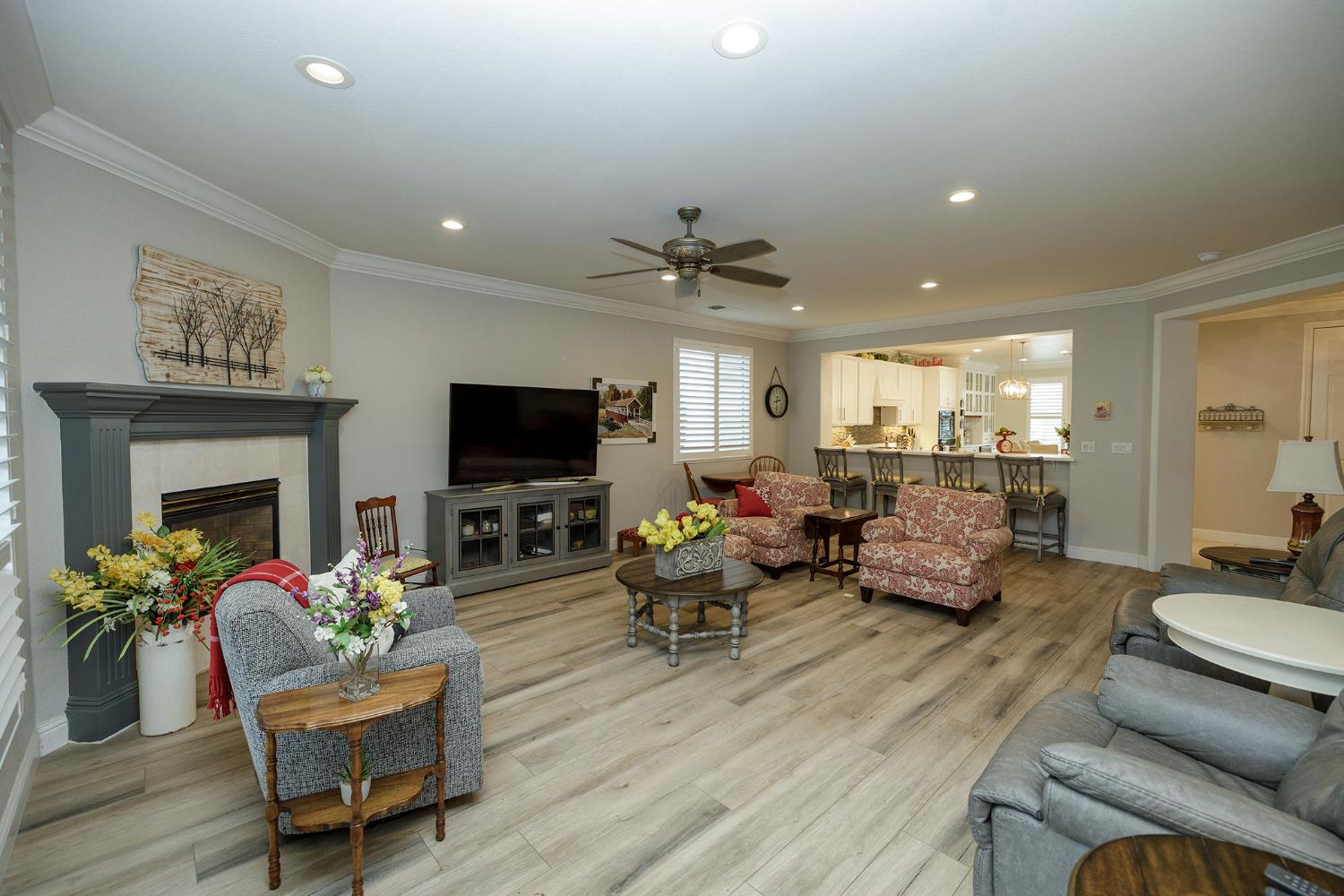 1771 Fox Trot Way Manteca, CA 95336 - Photo 13 of 54 a living room with furniture a flat screen tv and a fireplace