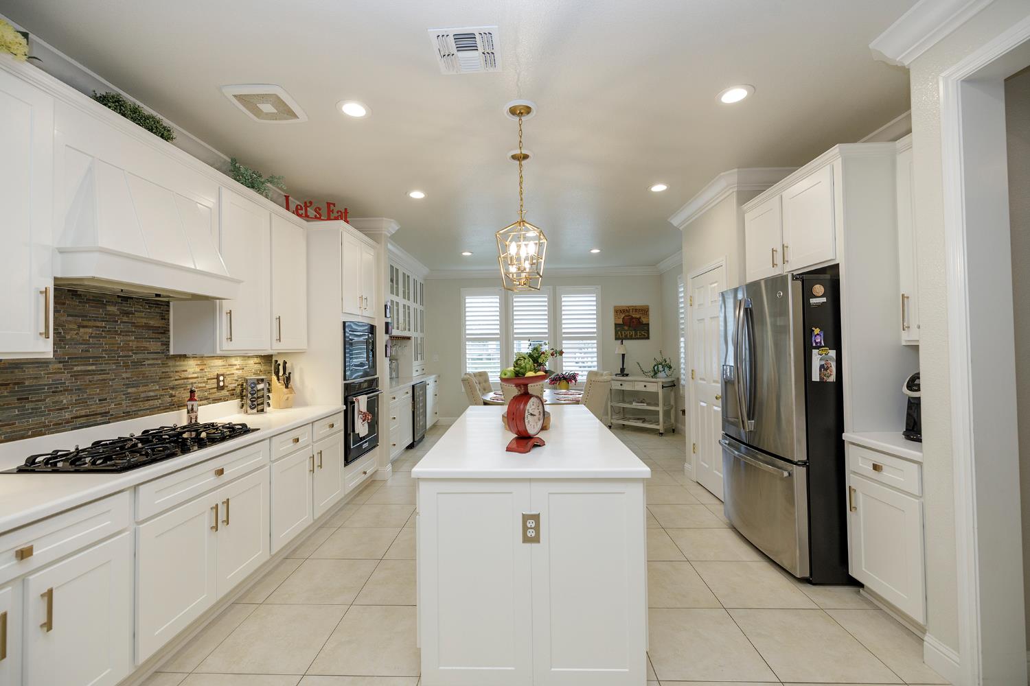 1771 Fox Trot Way Manteca, CA 95336 - Photo 16 of 54 a kitchen with stainless steel appliances a refrigerator sink and microwave