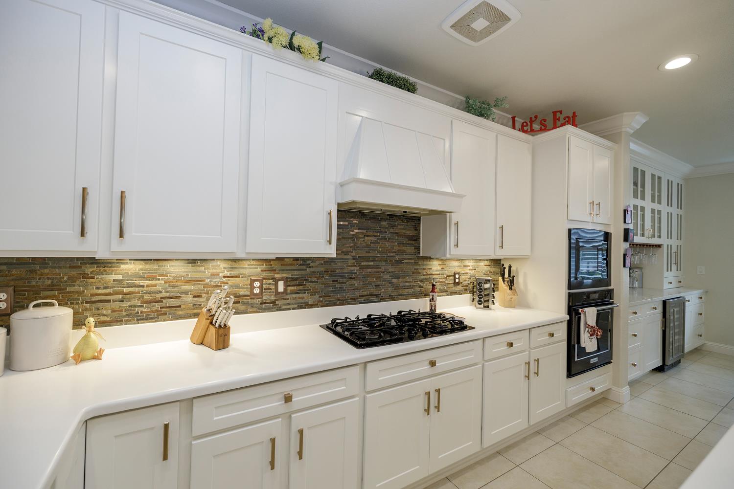 1771 Fox Trot Way Manteca, CA 95336 - Photo 19 of 54 a kitchen with stainless steel appliances white cabinets and a sink