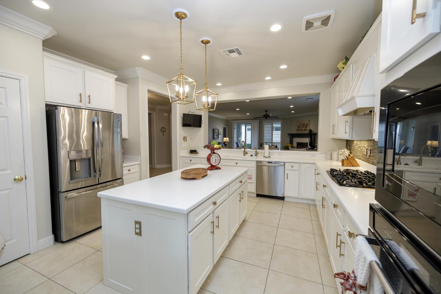 1771 Fox Trot Way Manteca, CA 95336 - Photo 21 of 54 a kitchen with white cabinets appliances and sink