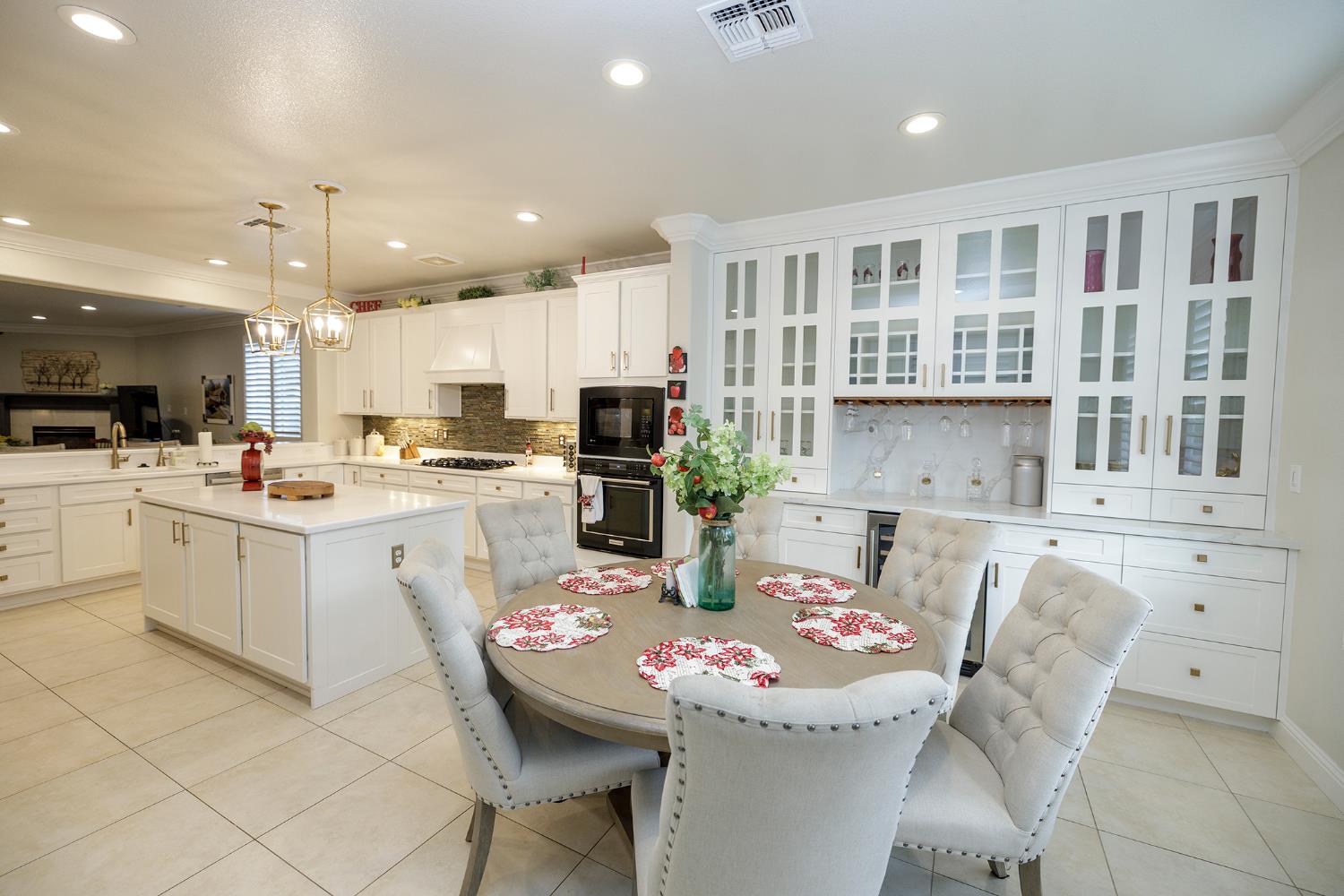 1771 Fox Trot Way Manteca, CA 95336 - Photo 26 of 54 a kitchen with stainless steel appliances kitchen island granite countertop a sink and cabinets