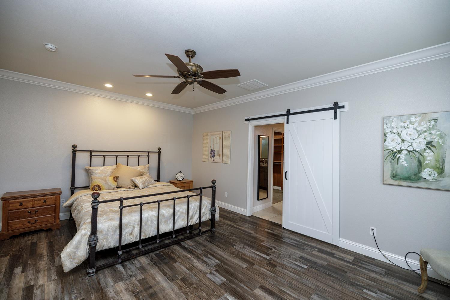 1771 Fox Trot Way Manteca, CA 95336 - Photo 27 of 54 a bedroom with a bed and a chandelier