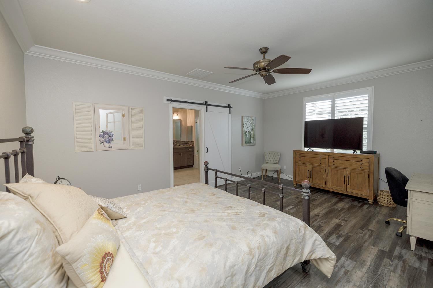 1771 Fox Trot Way Manteca, CA 95336 - Photo 29 of 54 a bedroom with a bed and a flat screen tv