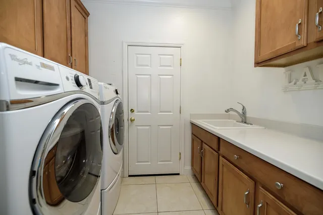 a group of chairs sitting in patio of a house