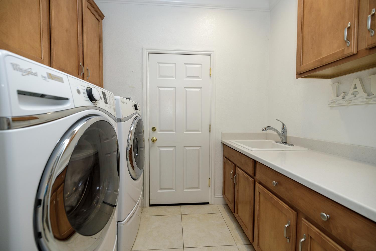 1771 Fox Trot Way Manteca, CA 95336 - Photo 40 of 54 a utility room with sink dryer and washer