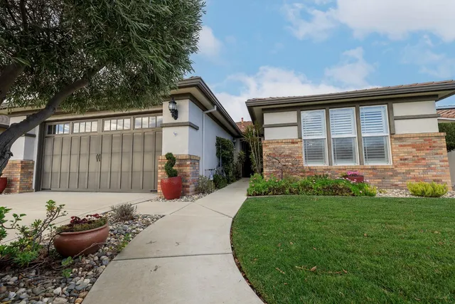 a view of a house with backyard and porch