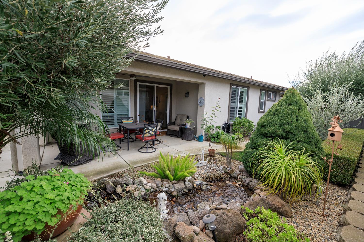 1771 Fox Trot Way Manteca, CA 95336 - Photo 44 of 54 a view of a chair and table in a backyard