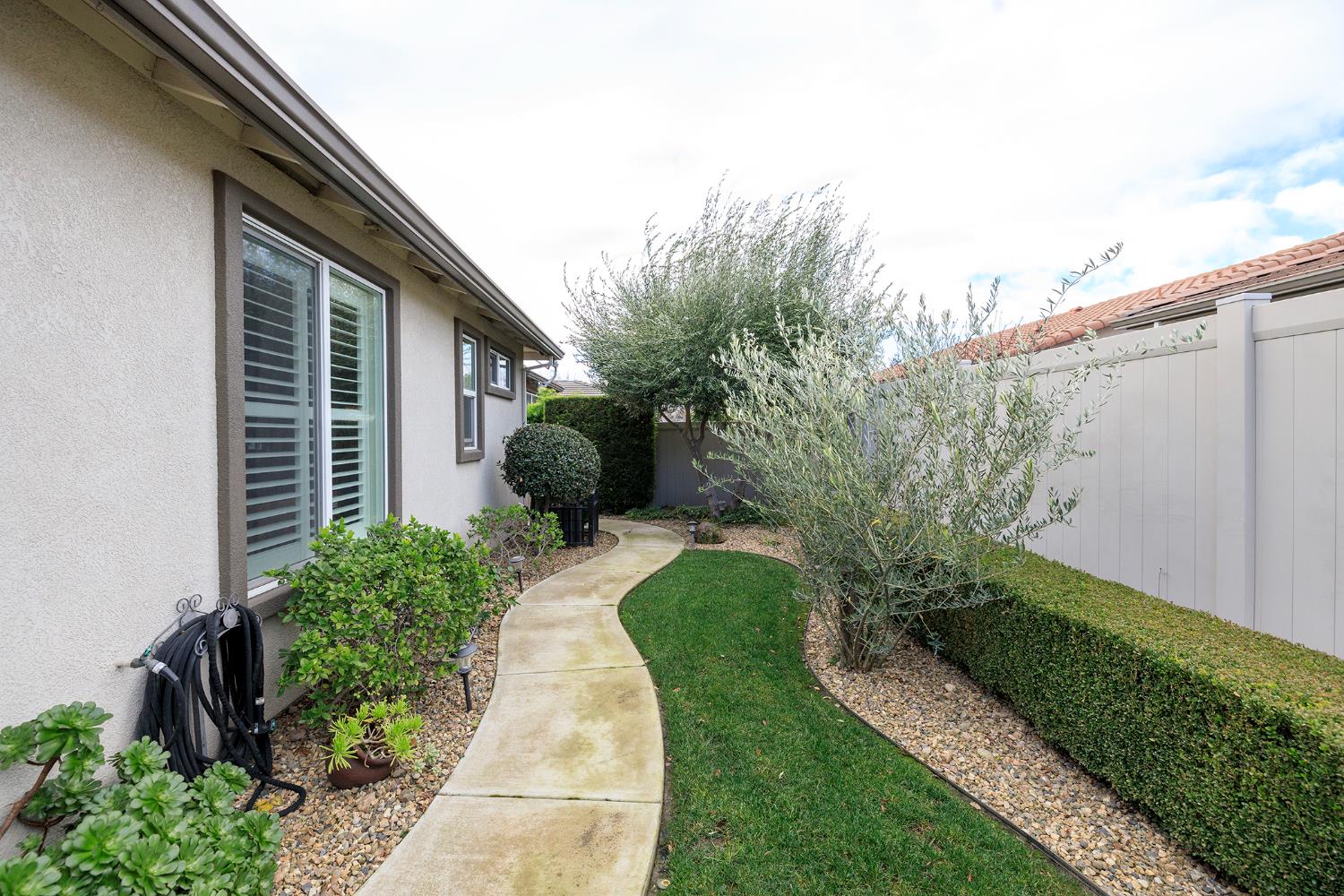 1771 Fox Trot Way Manteca, CA 95336 - Photo 51 of 54 a view of a garden with pathway