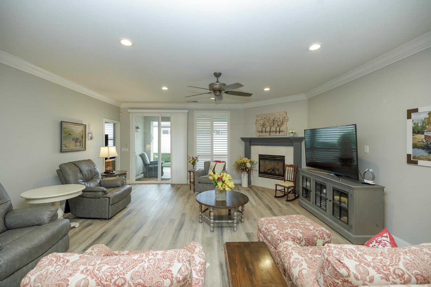 1771 Fox Trot Way Manteca, CA 95336 - Photo 9 of 54 a living room with furniture flat screen tv and a fireplace
