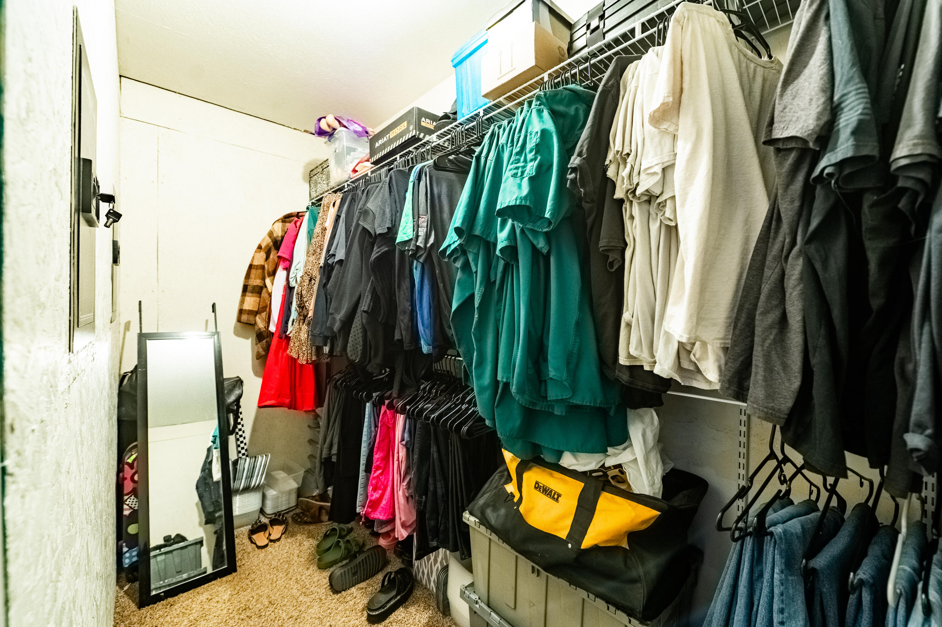 520 East 12th Street Littlefield, TX 79339 - Photo 12 of 17 a view of walk in closet with clothes and shoes