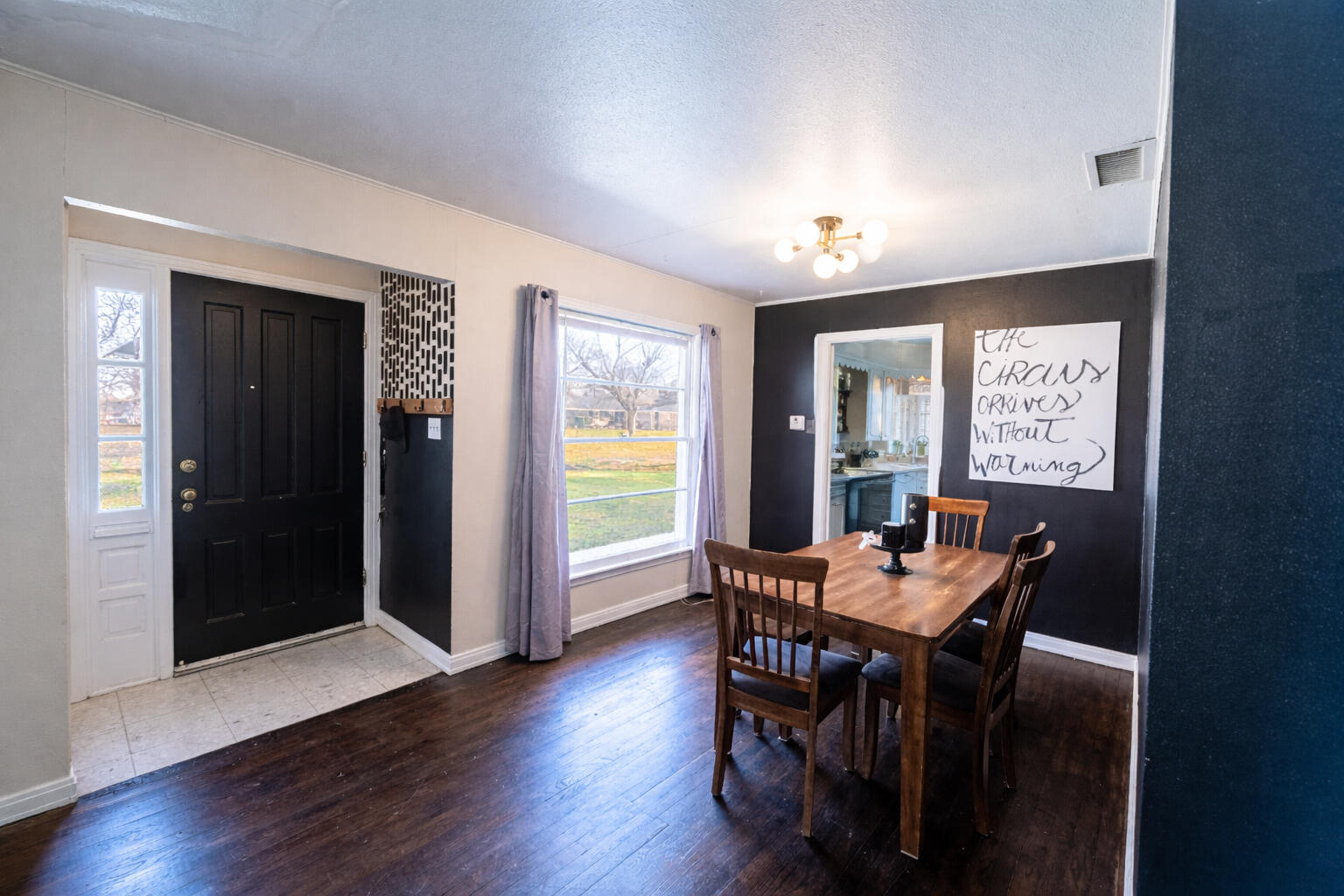 520 East 12th Street Littlefield, TX 79339 - Photo 13 of 17 a view of a dining room with furniture window and wooden floor