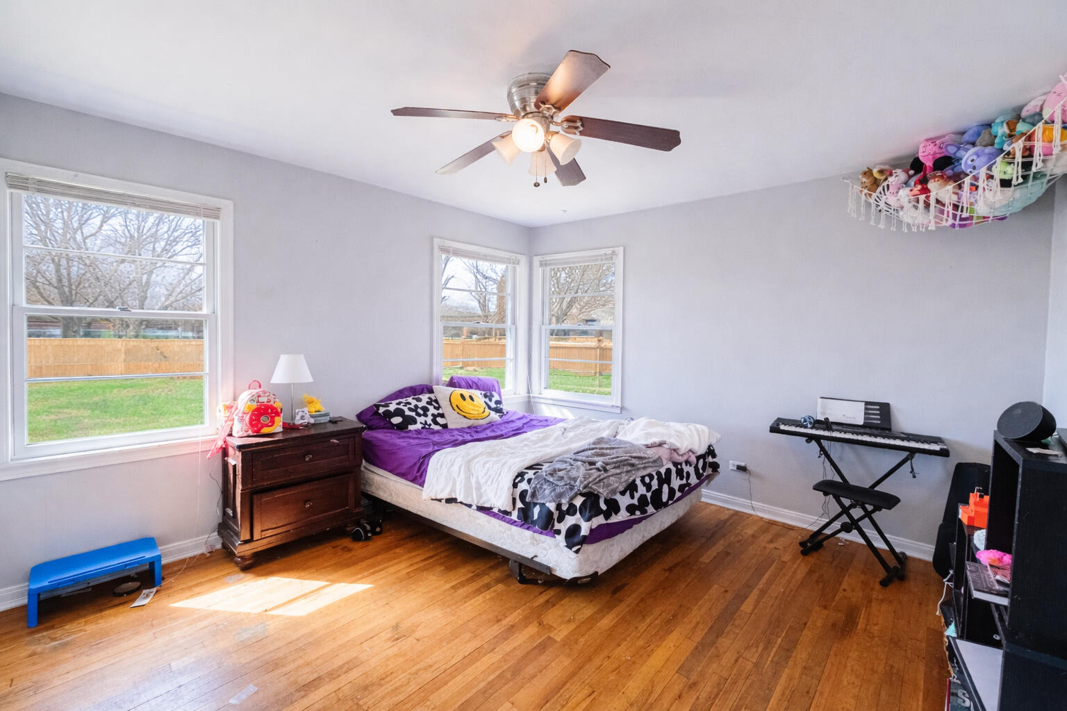 520 East 12th Street Littlefield, TX 79339 - Photo 15 of 17 a bedroom with a bed and a chandelier