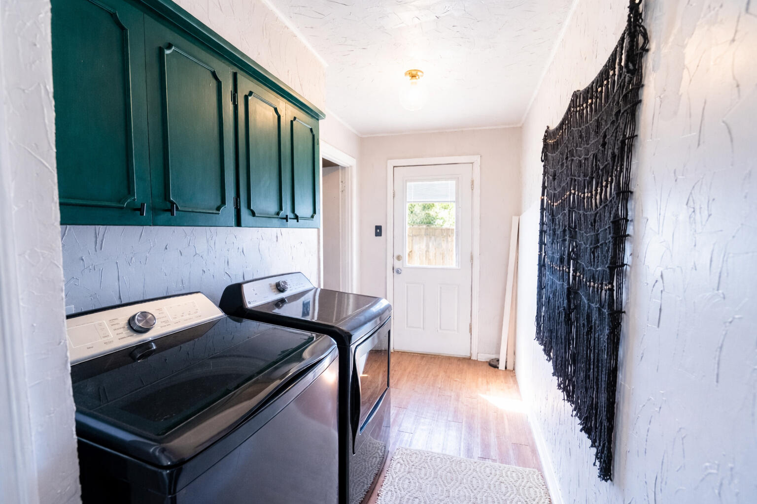520 East 12th Street Littlefield, TX 79339 - Photo 17 of 17 a kitchen with a stove and a wooden cabinets
