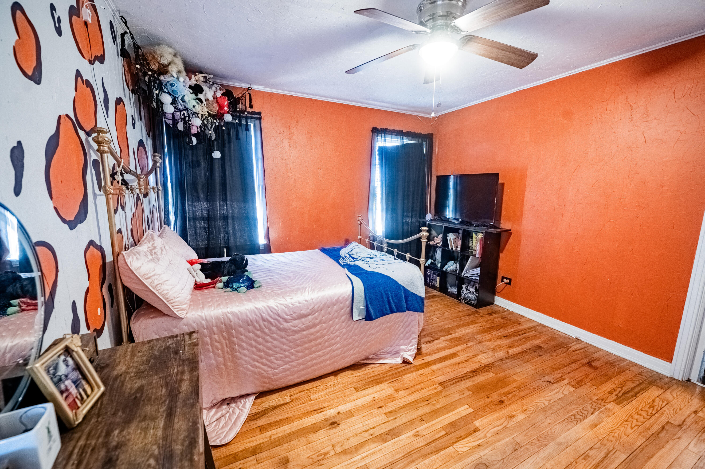520 East 12th Street Littlefield, TX 79339 - Photo 7 of 17 a bedroom with a bed and a chandelier