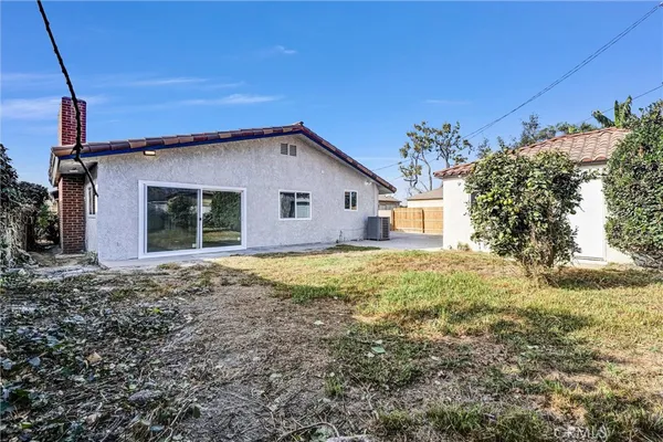 a view of a backyard of the house