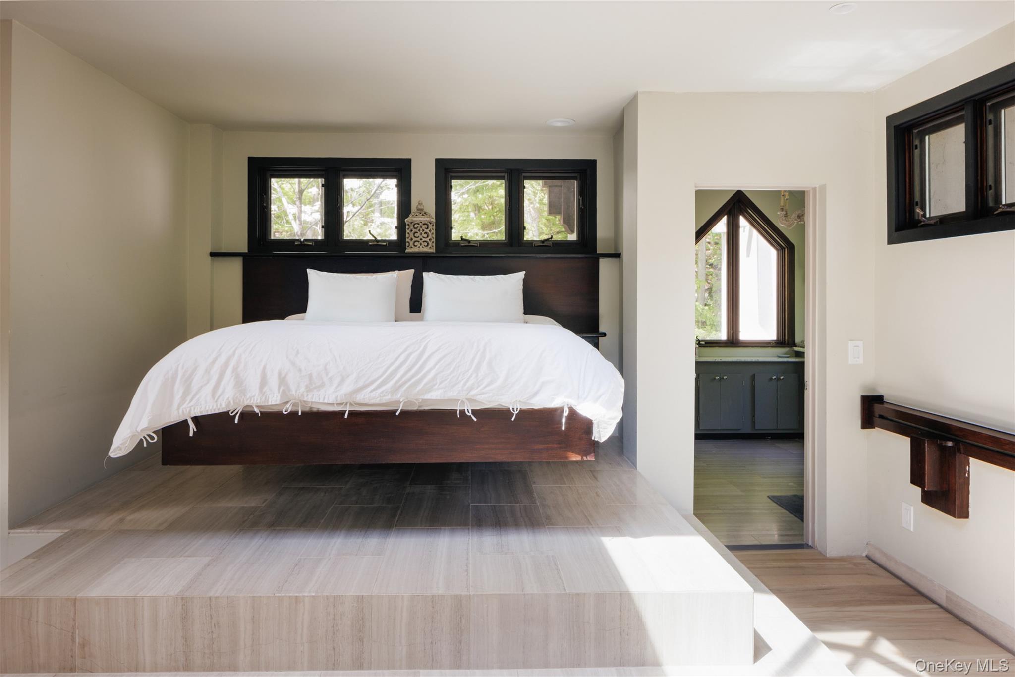 320 Long Hill Road Hopewell Junction, NY 12533 - Photo 18 of 42 a bedroom with a large bed and a large window