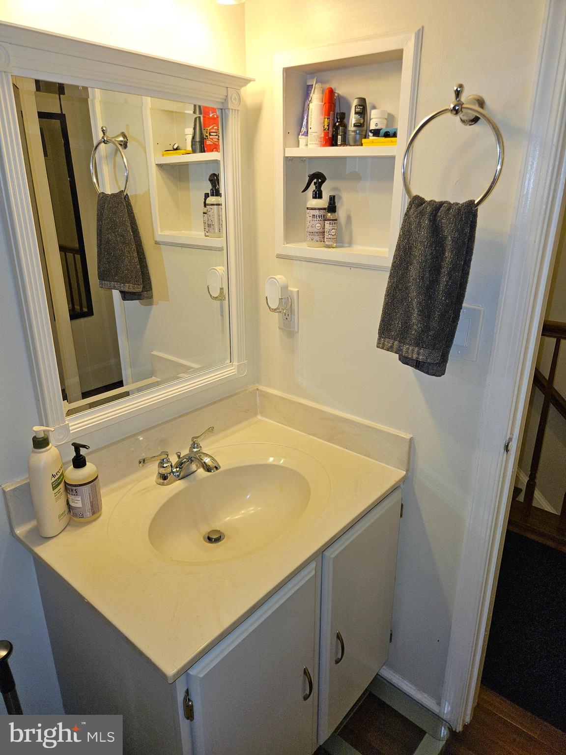 8317 Georgian Court Manassas, VA 20110 - Photo 12 of 15 a bathroom with a sink vanity and mirror