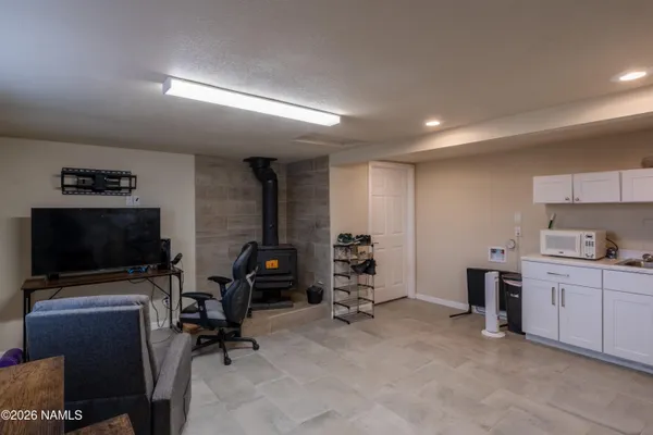 a room with furniture and a flat screen tv