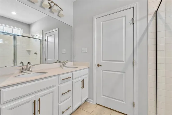 a bathroom with 2 sink and a mirror