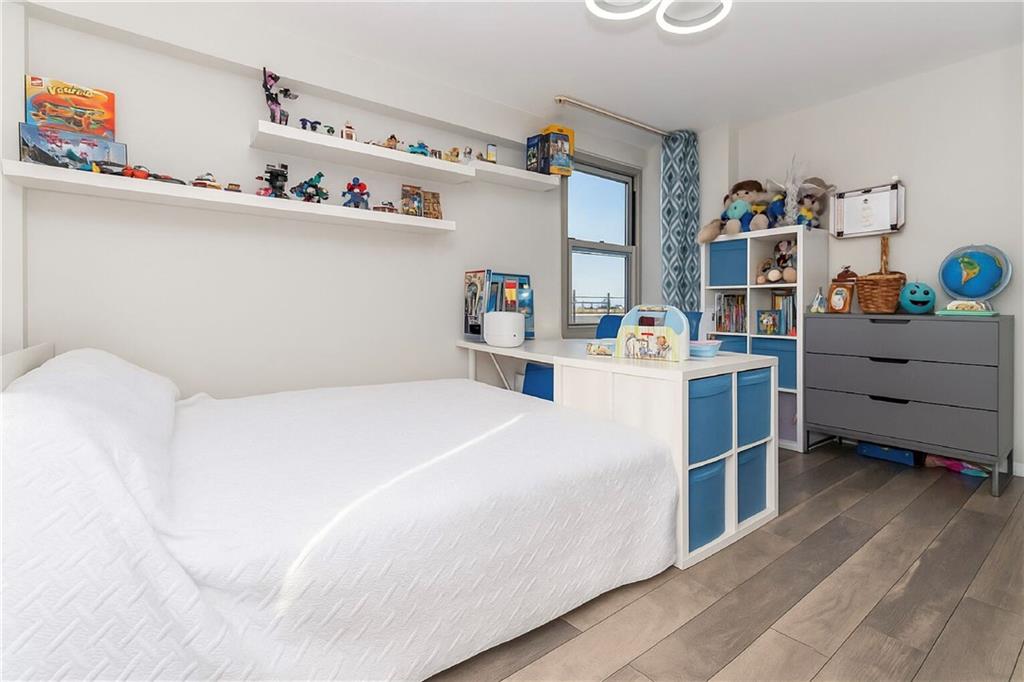 2652 Cropsey Avenue, Unit 9H Brooklyn, NY 11214 - Photo 13 of 23 a bedroom with a bed and storage