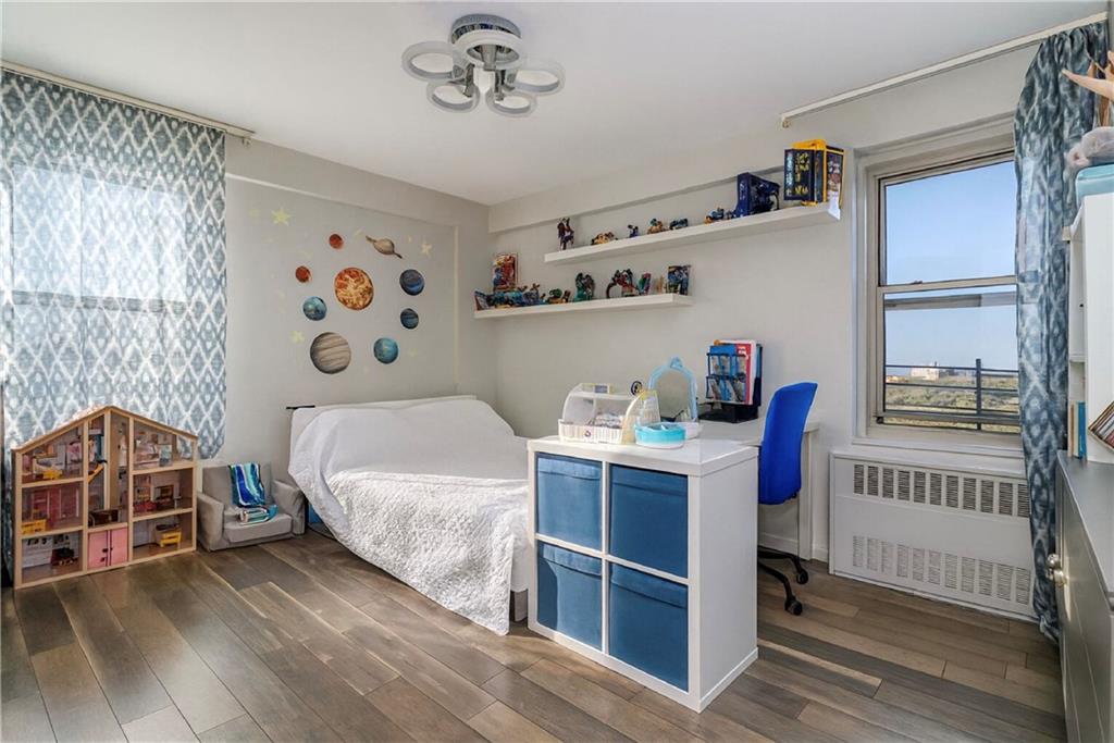 2652 Cropsey Avenue, Unit 9H Brooklyn, NY 11214 - Photo 14 of 23 a bedroom with a bed and a window