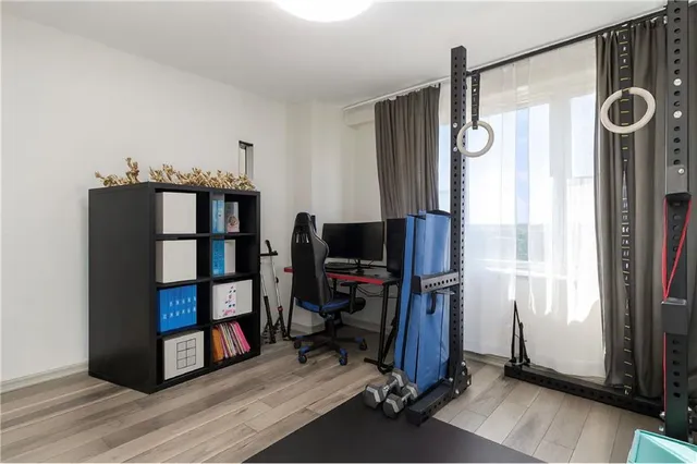 a view of a livingroom with furniture and a window