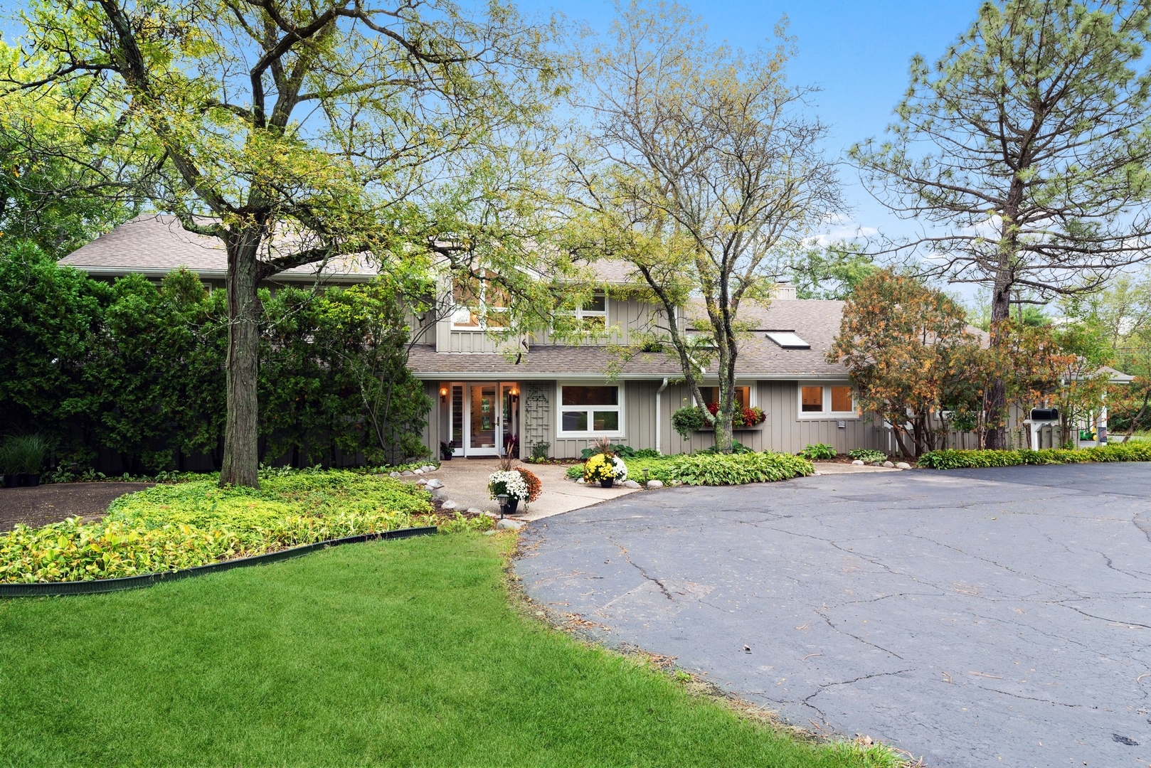 470 Voltz Road Northbrook, IL 60062 - Photo 2 of 58 a view of a patio with table and chairs under an umbrella