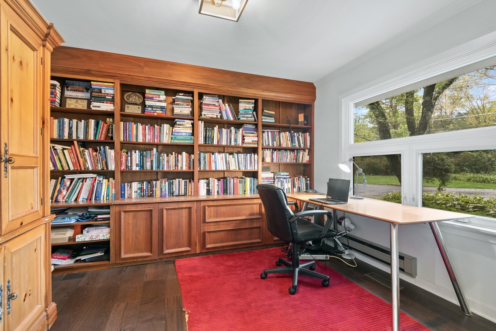 470 Voltz Road Northbrook, IL 60062 - Photo 24 of 58 a view of a workspace with furniture and a bookshelf