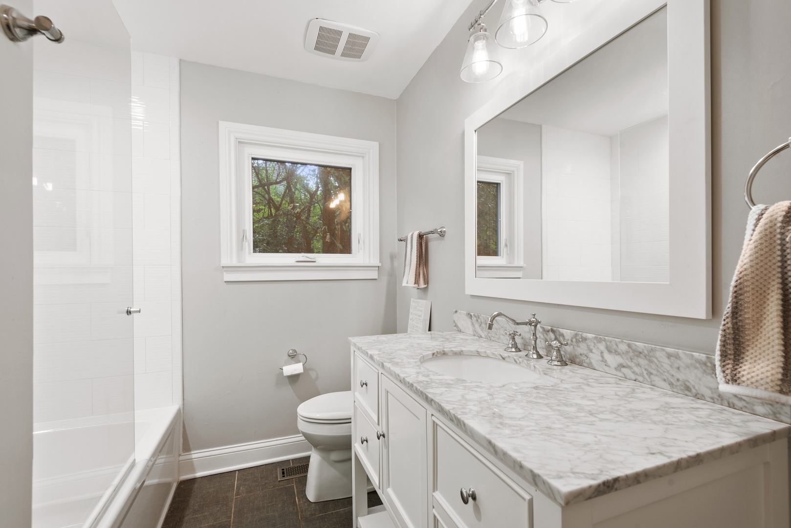 470 Voltz Road Northbrook, IL 60062 - Photo 29 of 58 a bathroom with a granite countertop sink a toilet and a mirror