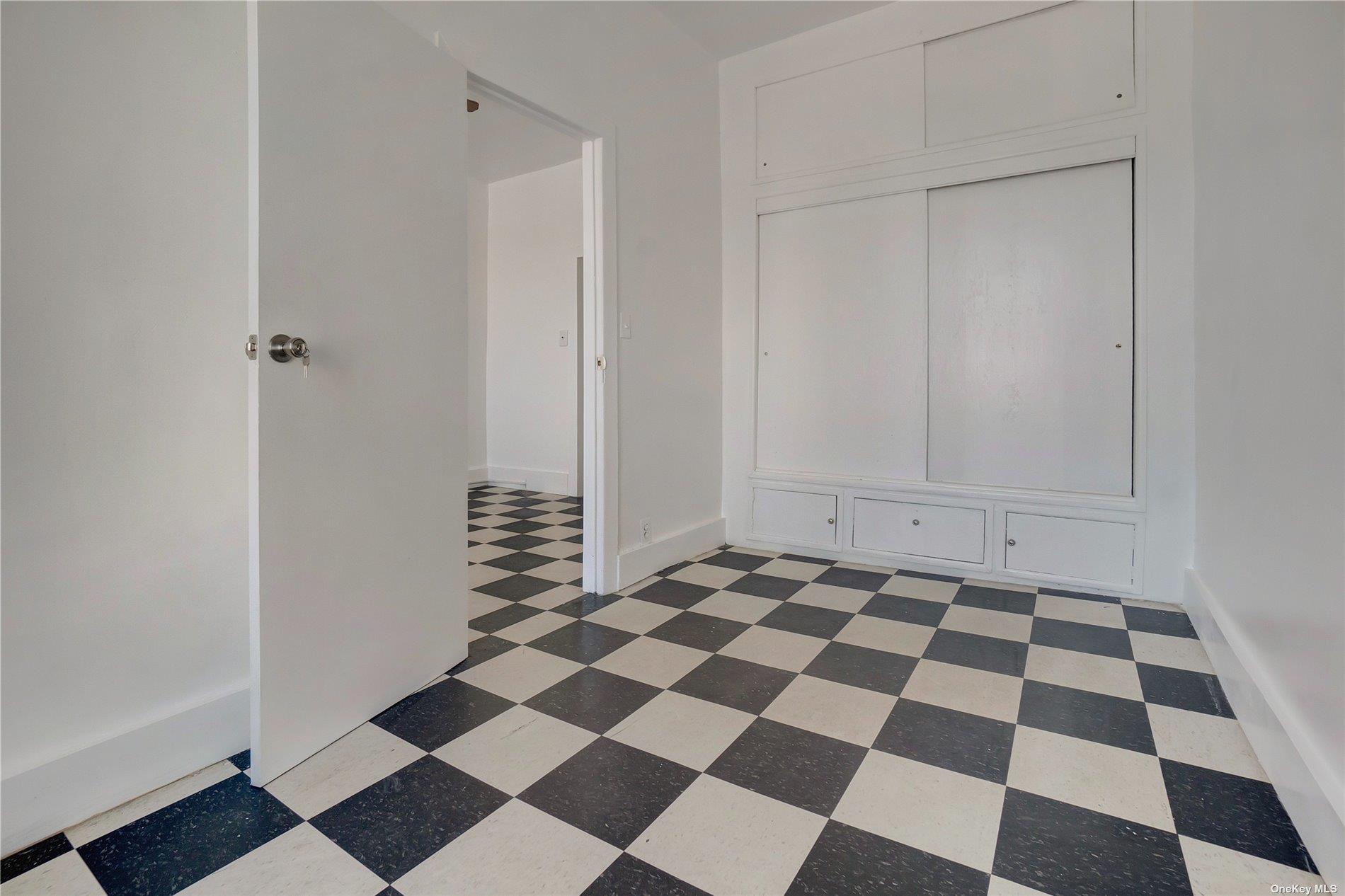 76 Richardson Street, Unit 7 Brooklyn, NY 11211 - Photo 4 of 9 a black and white checkered floor with a black white checkered floor