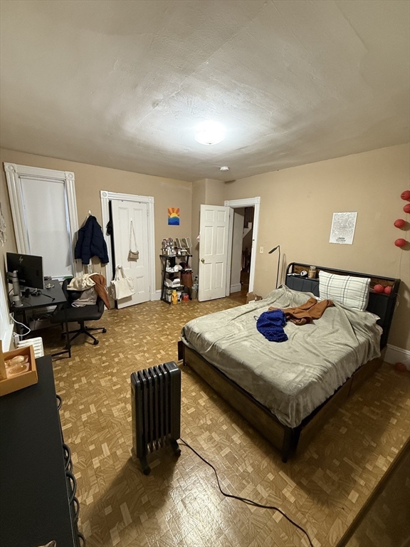 10 Eldora Street Boston, MA 02120 - Photo 20 of 26 a living room with furniture a flat screen tv and a table