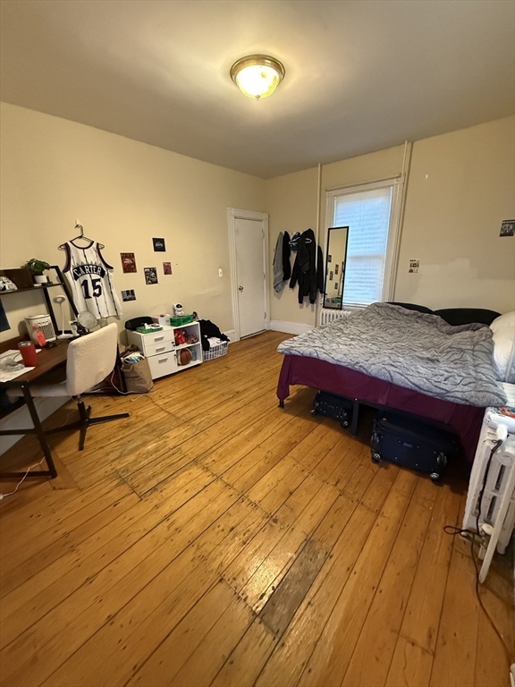 10 Eldora Street Boston, MA 02120 - Photo 5 of 26 a bed room with a bed and a chair