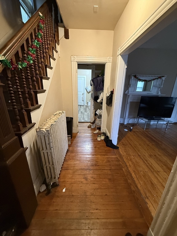 10 Eldora Street Boston, MA 02120 - Photo 9 of 26 a view of a hallway with wooden floor and staircase