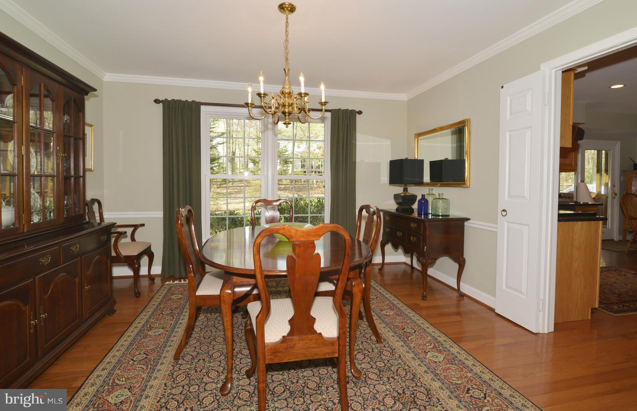 10713 Cross School Road Reston, VA 20191 - Photo 9 of 30 The dining room has hardwoods and mouldings.