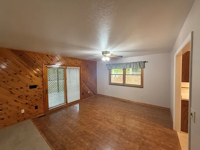 a view of livingroom with window and hardwood floor