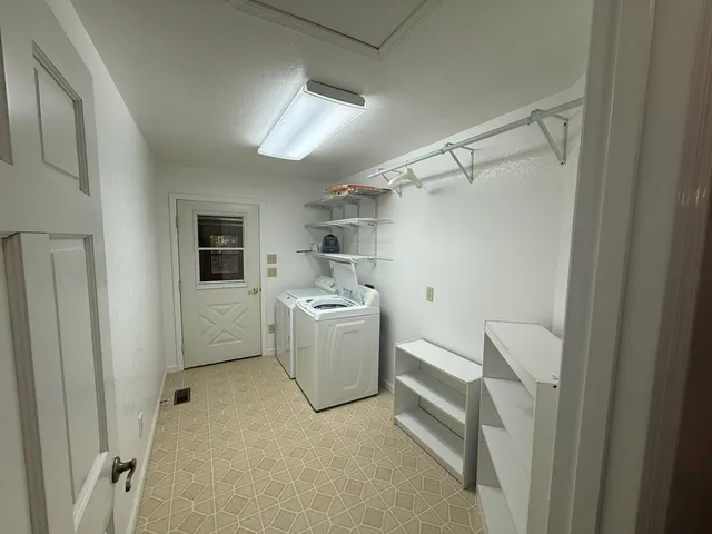 an empty room with a empty space and windows