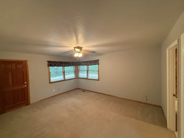 a view of storage and utility room with racks on the wall