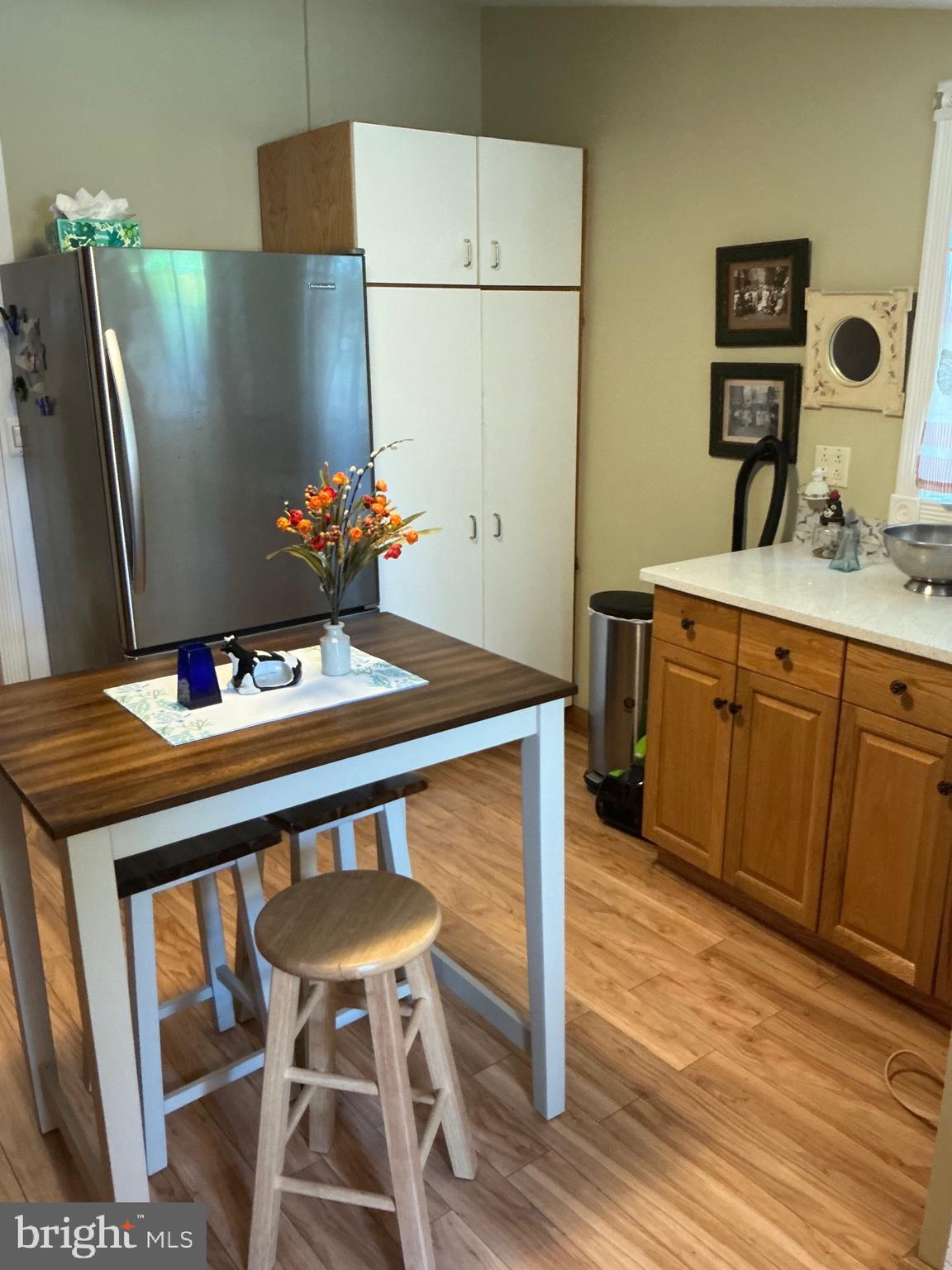 29 Centre Street Haddonfield, NJ 08033 - Photo 20 of 39 a kitchen with stainless steel appliances a stove a refrigerator and a dining table